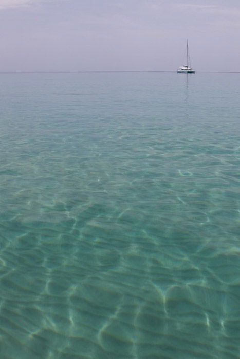 A serene view of a  boat at sea - photography composition rules