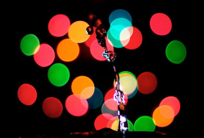 Bright bokeh lights behind a water splash