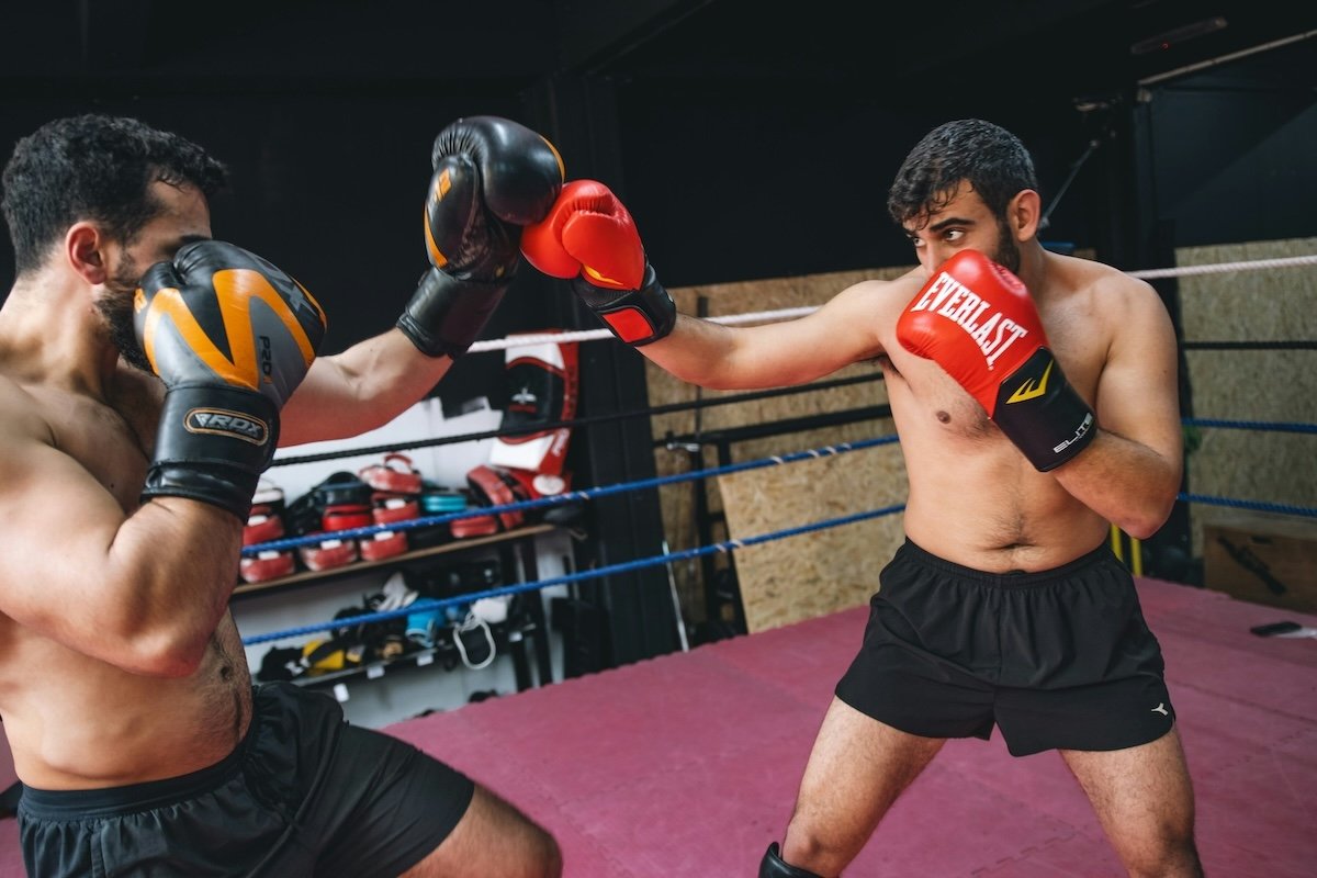 Two mixed martial artists sparring as an example of sports photography