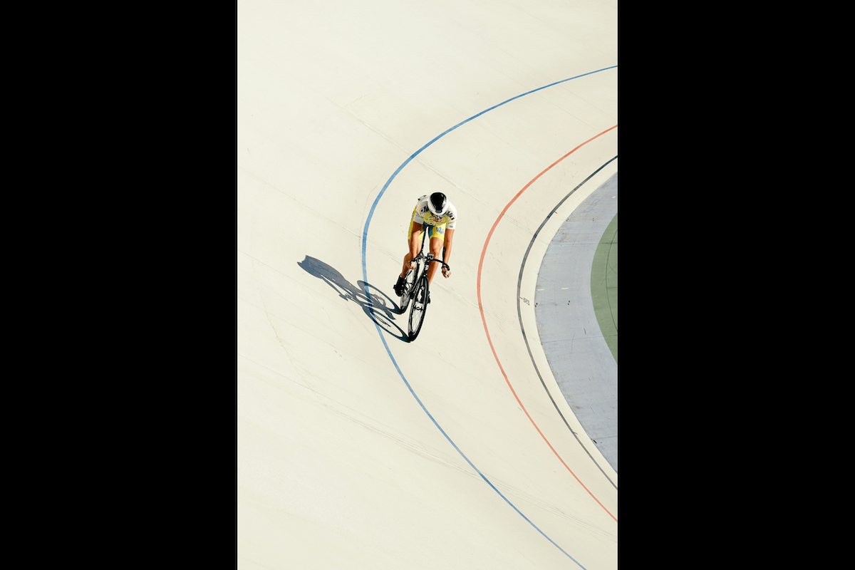 A racing cyclist on a race track as an example for sports photography