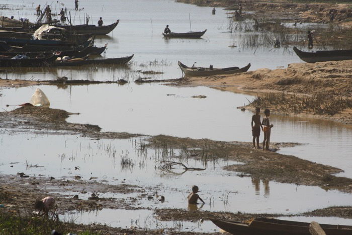 An image of African kids near a dry river