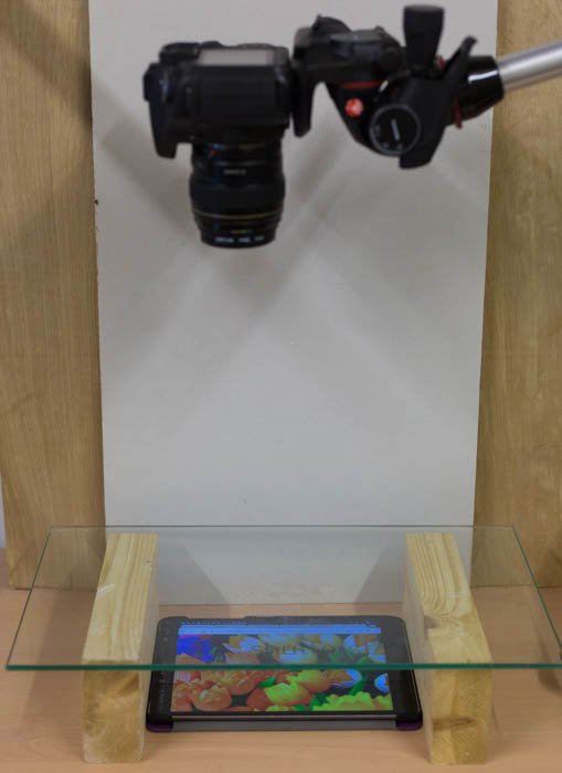 A camera capturing a tablet with a photo of tulips