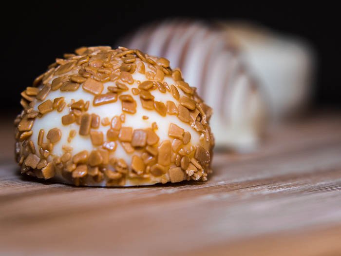 Pralines on a wooden plate - Macro photography tips