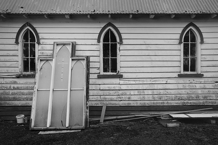 black and white documentary photography of Whare Karakia church awaiting repairs