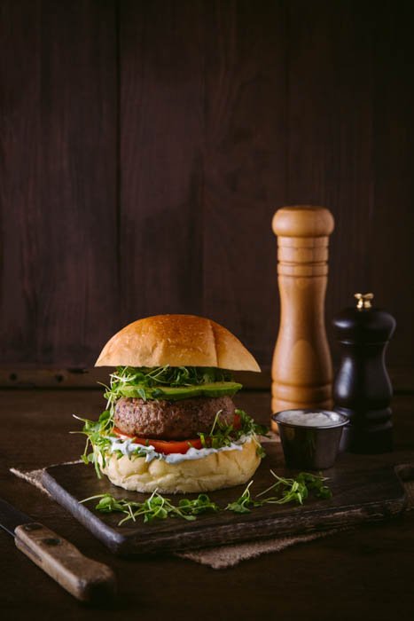 lamb burger on cutting board