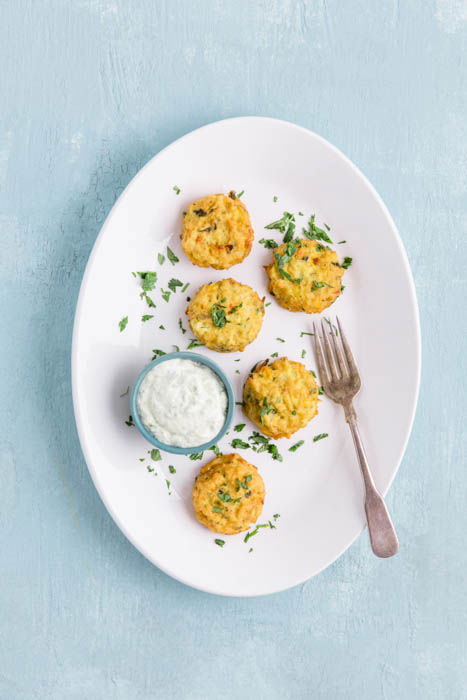 kale and corn cakes food photography placed in groups of triangles