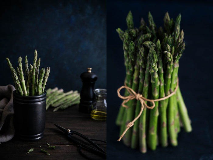 food photography of a bunch of asparagus on a dark background
