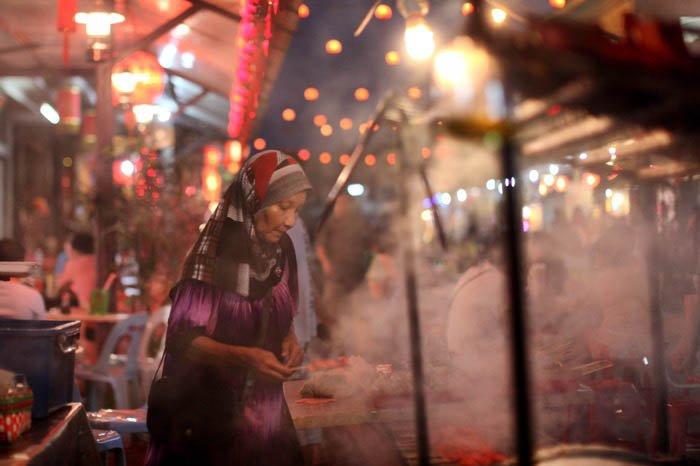 A night street shot of a street food vendor 