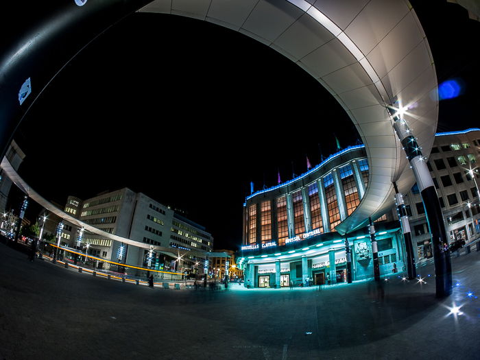 Dramatic distorted view of the main entrance of Brussels Central Station at night taken with fisheye lens. Architectural photography