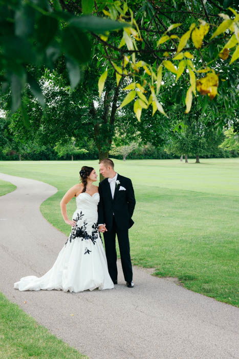 A bride and groom posing outdoors