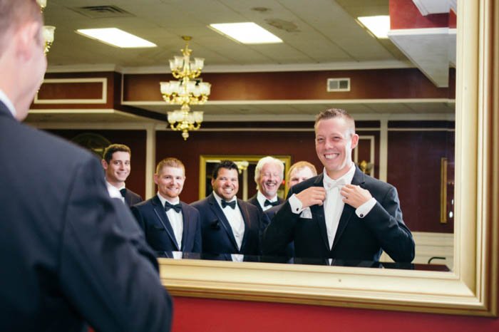 groom and groomsmen photographed in a mirror