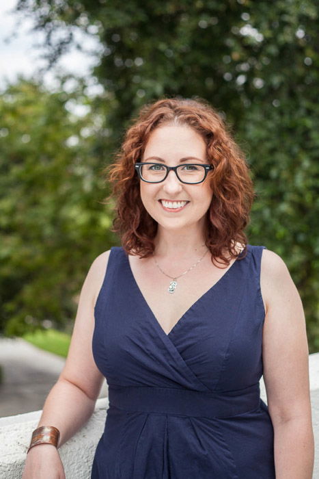 Outdoor portrait of a woman in glasses