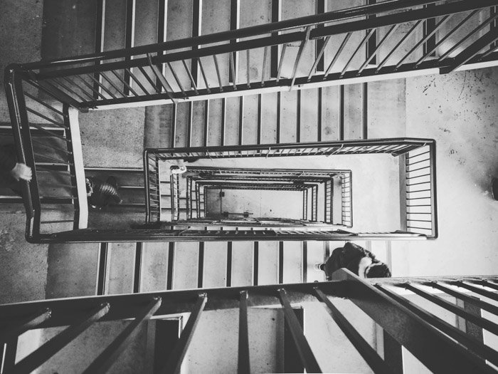 Overhead view of a winding staircase in a multifloored building