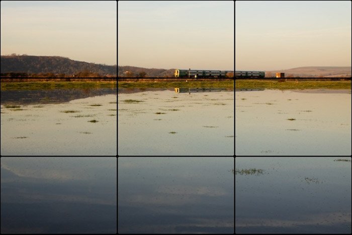 The rule of thirds photography composition grid overlaid on a seascape photo