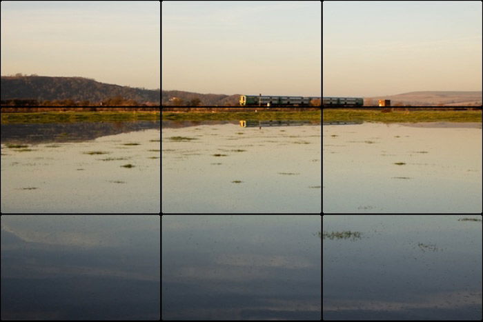 The rule of thirds photography composition grid overlaid on a seascape photo