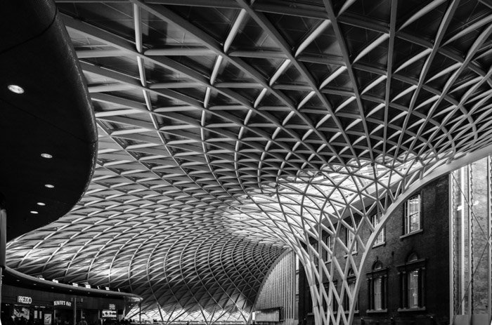 black and white photo of the ceiling of King's Cross London railway station