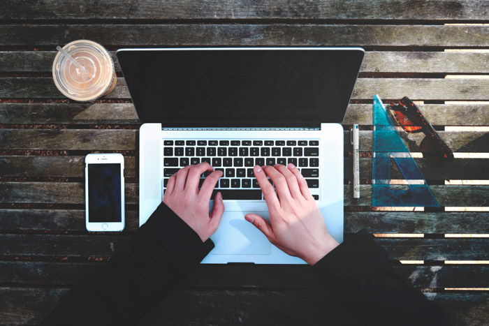 Overhead shot of a person working on a laptop