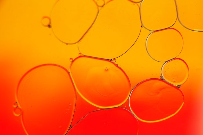 intense red and orange background with bubble forms