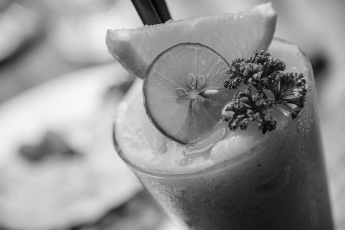 flat black and white photography close up of a cocktail drink
