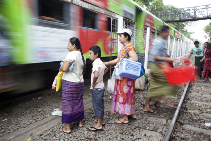 Street Photography of a crowd of people waiting for a train.