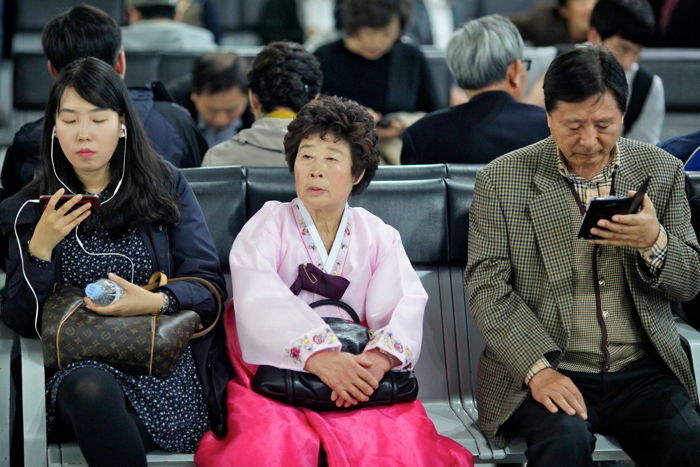 Photo of people in a waiting room.