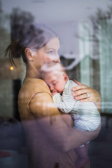 Nora Lorek portrait of mother holding baby.