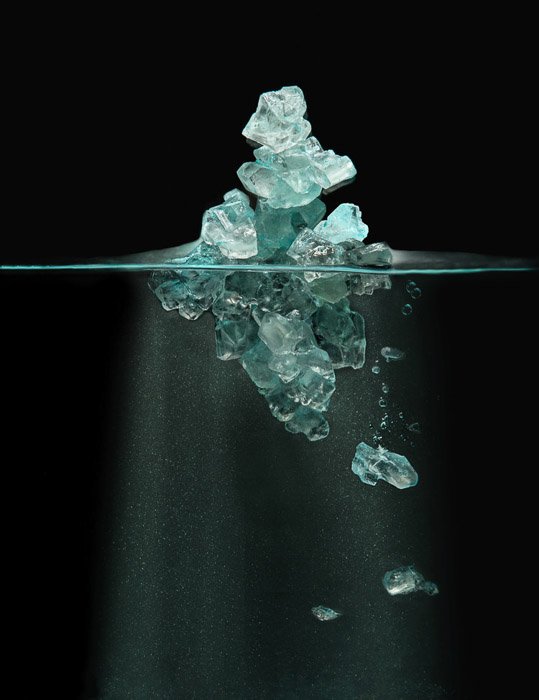 still life of blue crystals or ice in eater by Robert Clark