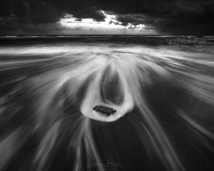 Luminous fine art landscape photography shot of the seashore in black and white