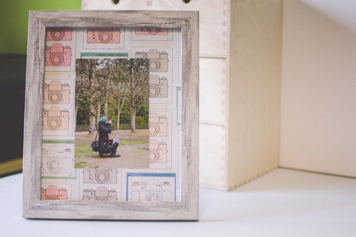 A photograph in a frame with a camera-designed mat as an idea of what to do with photos