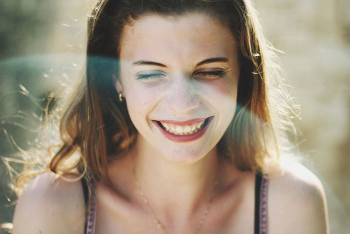 Bright and airy portrait of a girl with a blurry background. 