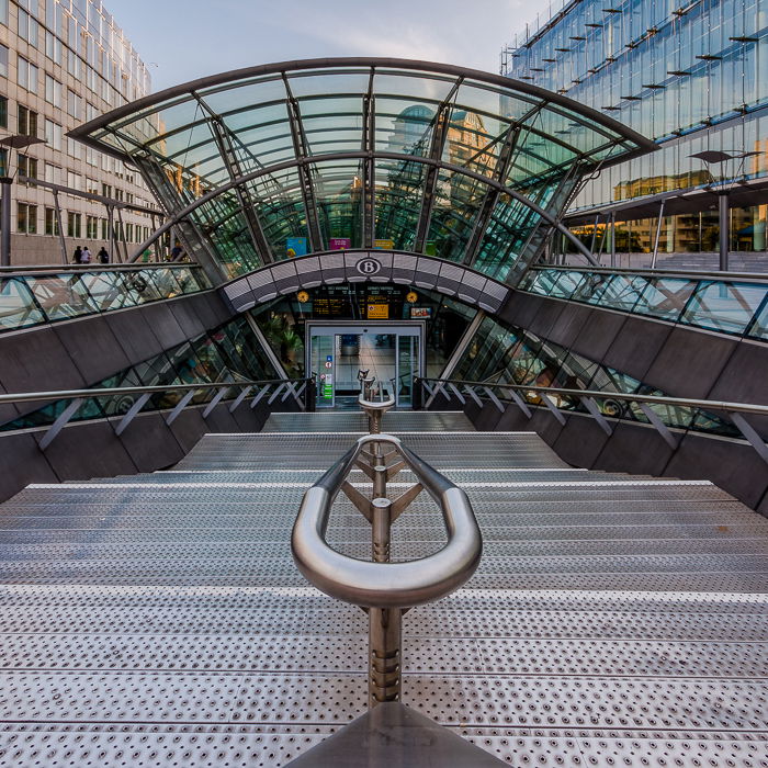 Front view looking down the steps of the entrance of the Luxembourg Metro Station in Brussels. urban photography