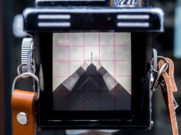 Looking up at a modern building through an old Yashica Mat LM TLR camera.