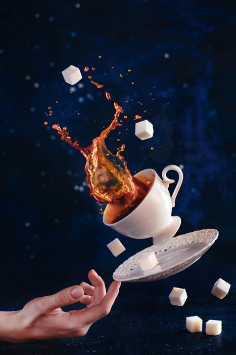 A creative coffee splash photography still life with falling coffee cups on dark background