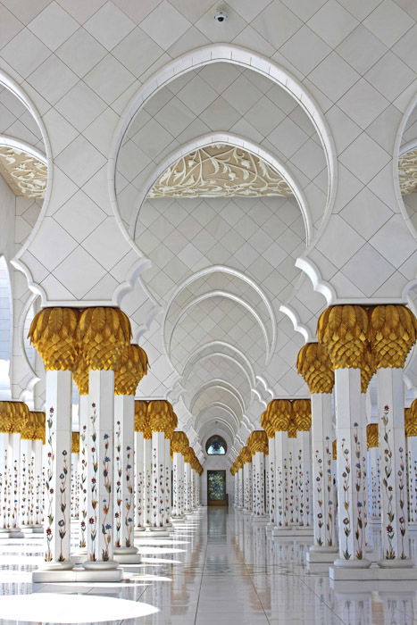 Interior of an elaborate and impressive multi columned room demonstrating symmetrical weight balance in photography.