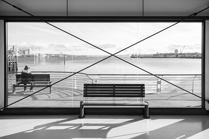 A black and white street photography shot of Devonport, Auckland, in the bright sun.