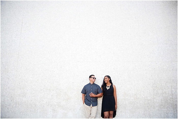 happy stylish couple standing back to back, posing on yellow background,  student outfit, youth Stock Photo by LightFieldStudios