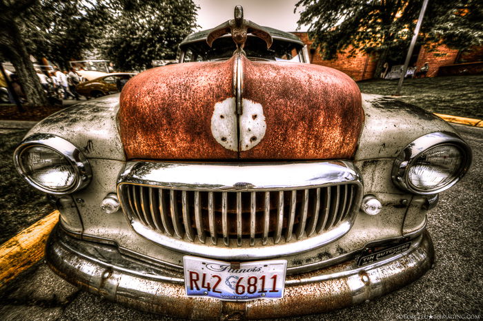 A porttrait of a rusty car hubcap - freelance photography shot