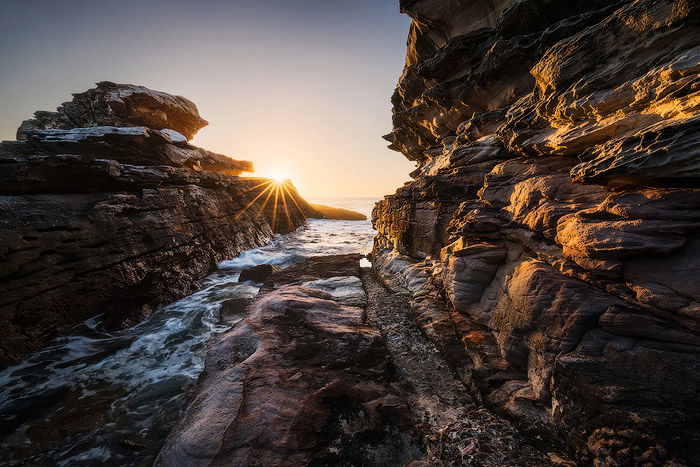 A rocky seascape at sunset