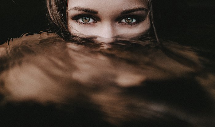 Mickael Cresset close up portrait of a girl with the bottom half of her face underwater - surreal photography