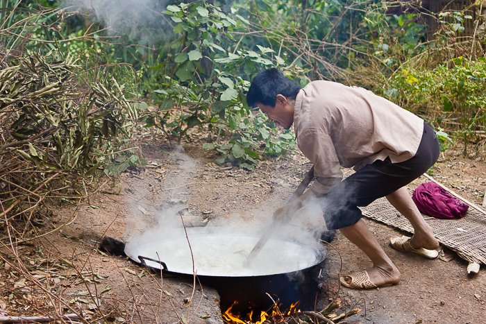 Man making rice whiskey at minority village in Mai Chau in Vietnam. 