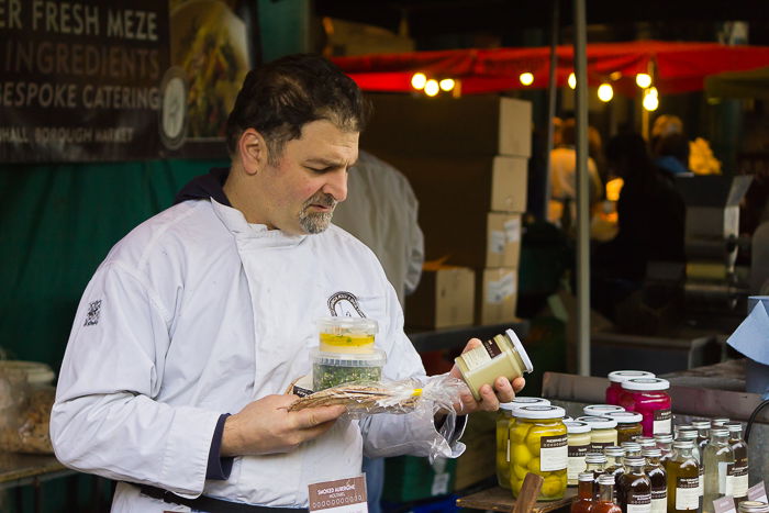 Portrait photography of a market trader at a stall in Borough Market. Vietnam 