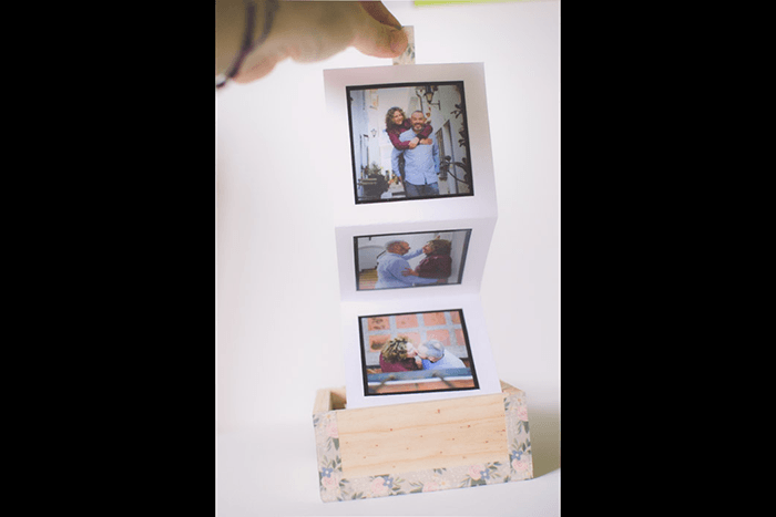 A photo accordion in a box as a unique idea for what to do with photos