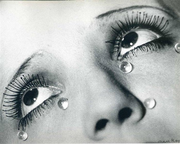 Man Ray close up of a womans eyes with round teardrops on her face - famous photographers