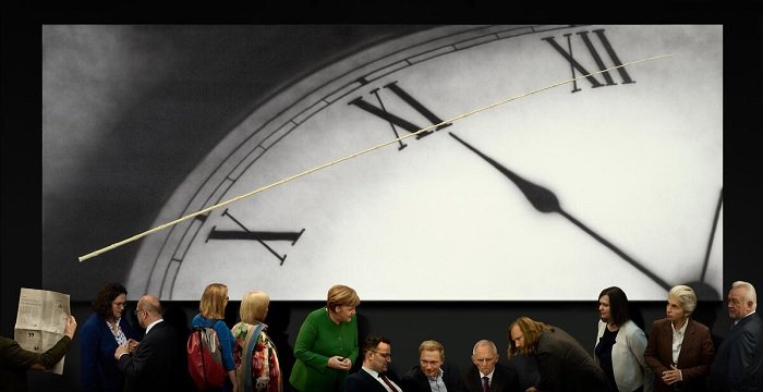Composite of European politicians in front of a clock face