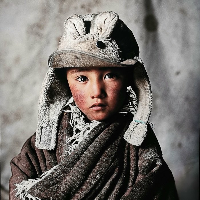 Portrait of Mongolian child in a hat