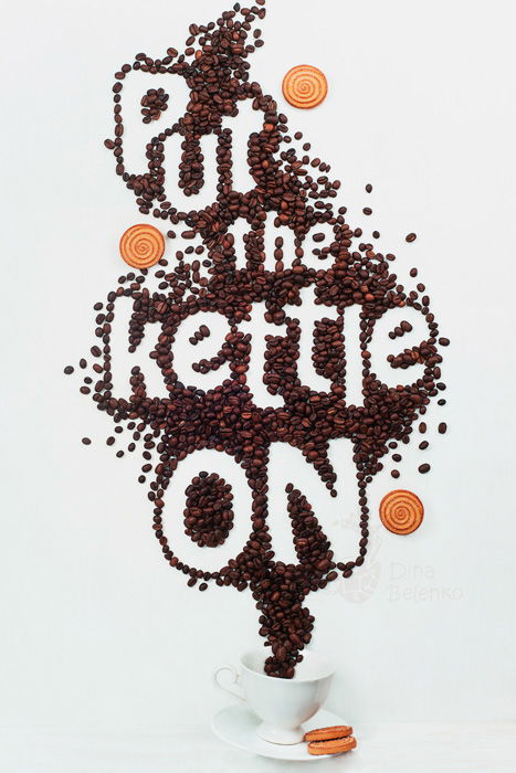 A food art shot featuring coffee cup, saucers, biscuits with food typography message 'put the kettle on'.