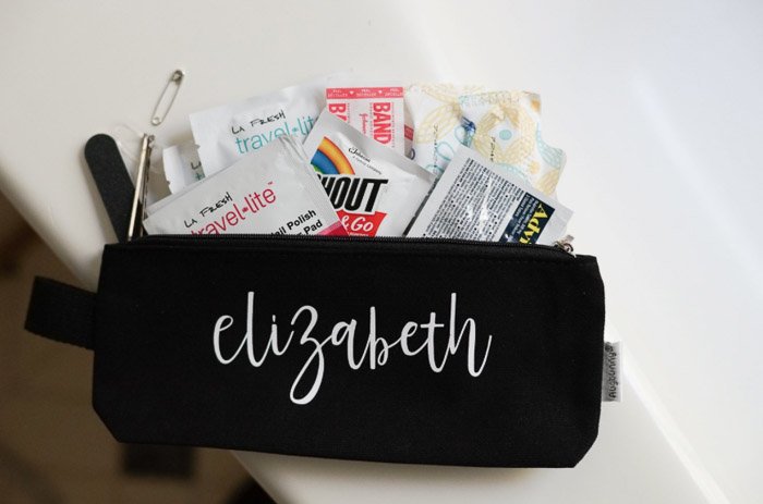 Close up shot of a black 'elizabeth' case with toiletries, first aid kit and accessories for a boudoir shoot