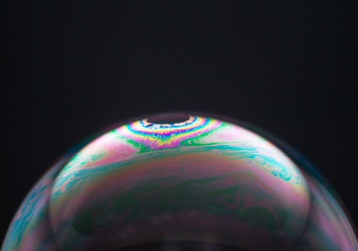 Cool macro bubble photography of soap bubbles on black backround