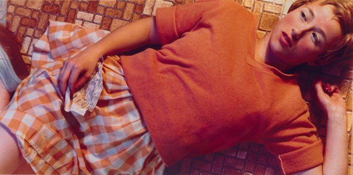 A Cindy Sherman photograph of a female model lying on the floor 