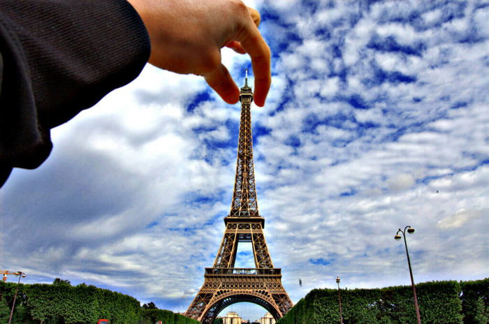 Classic forced perspective idea of a person 'holding' the Eiffel tower